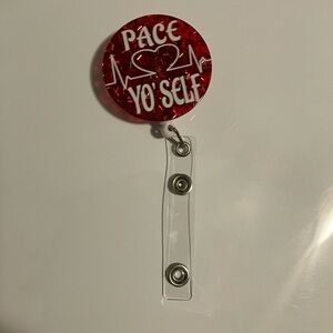 Red Badge Reel with Heart Design